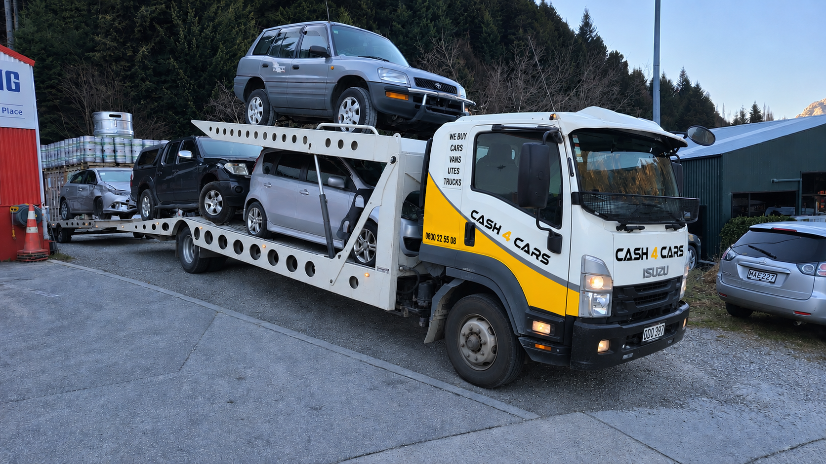 Cash4Cars car transporter loaded with vehicles at the yard